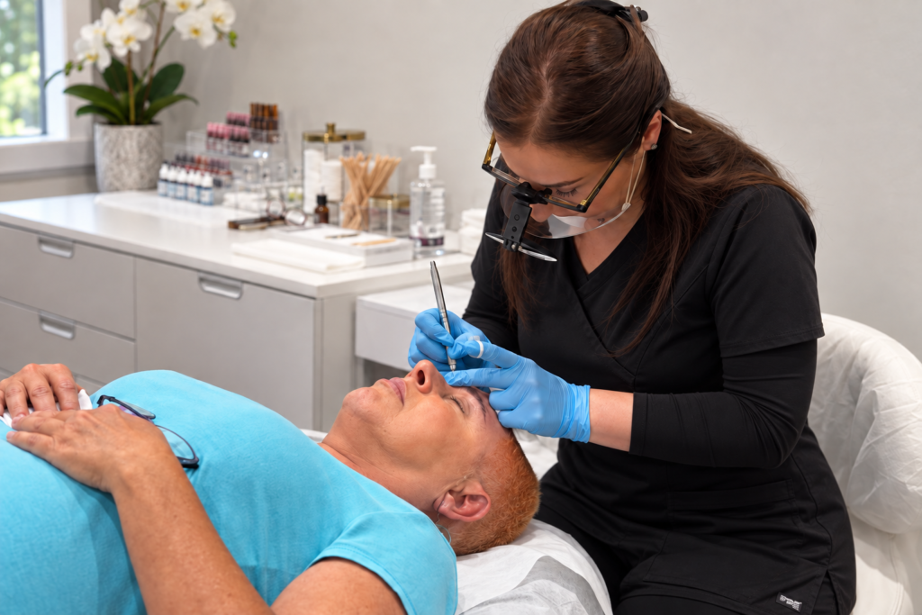 Master Microblading Artist Eveline Benjamin performing a precision Microblading eyebrow procedure at Brow Me Pretty in Scottsdale, Arizona